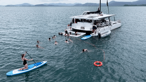 Room-Res Island guests enjoying the water during the catamaran adventure